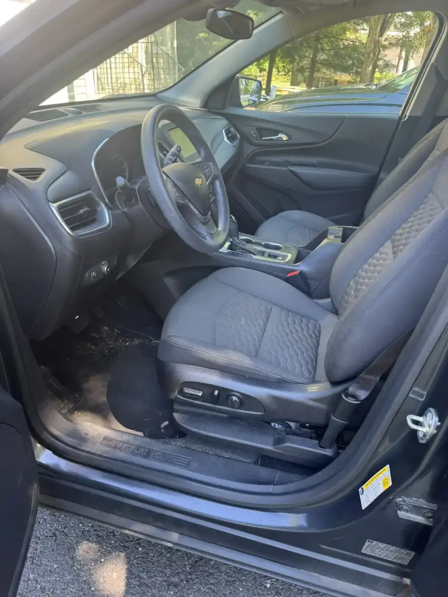 Car interior before mobile detailing. Dirty front seat needs professional car cleaning
