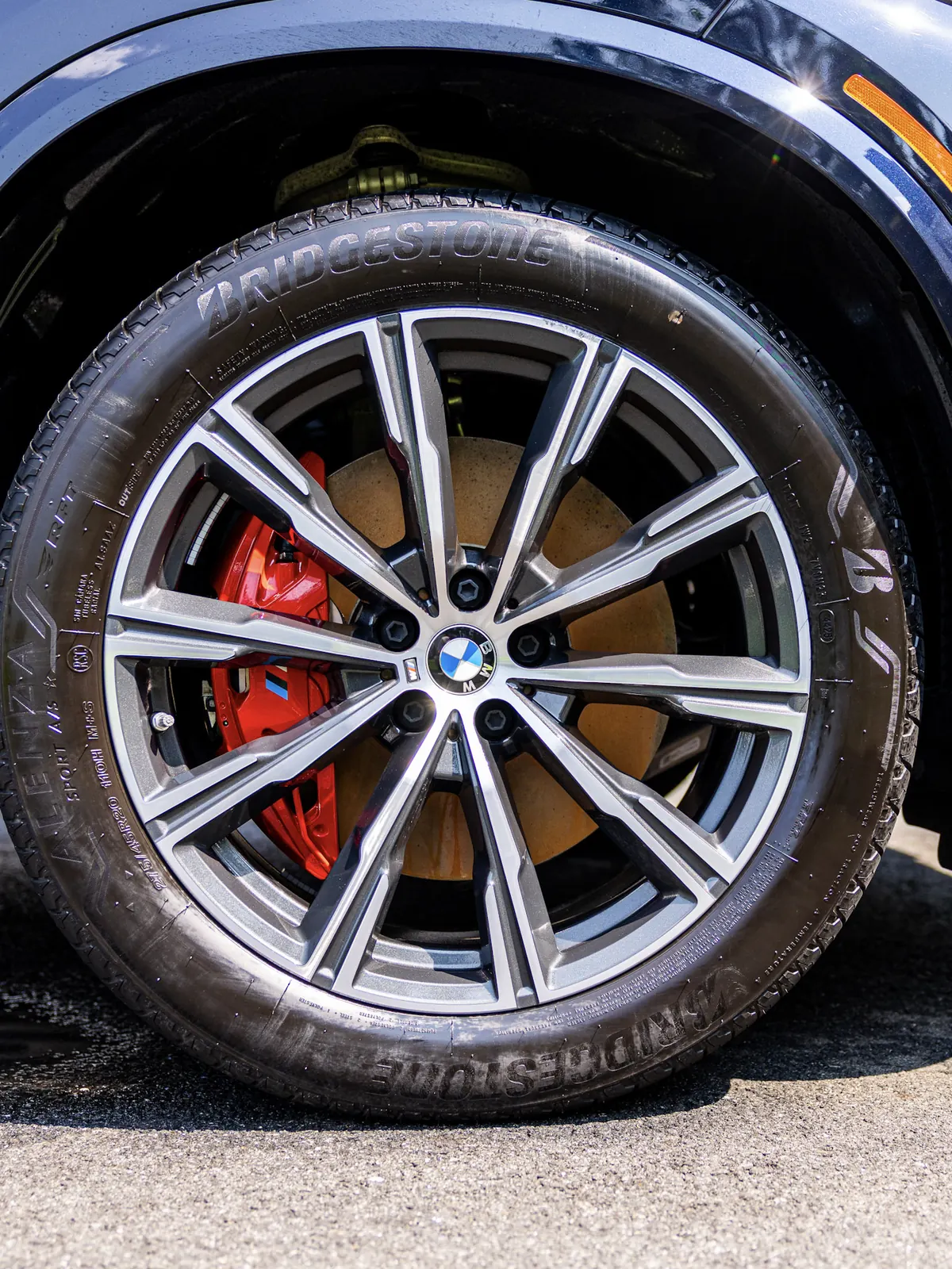 Clean BMW X5 wheel with red brake caliper after a wheel cleaning