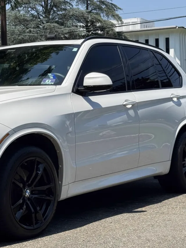 White BMW X5 with clean paint and black wheels after an exterior detail