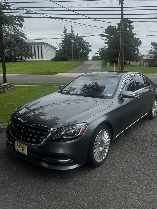 Gray Mercedes S-Class with clean paint and wheels after an exterior detail
