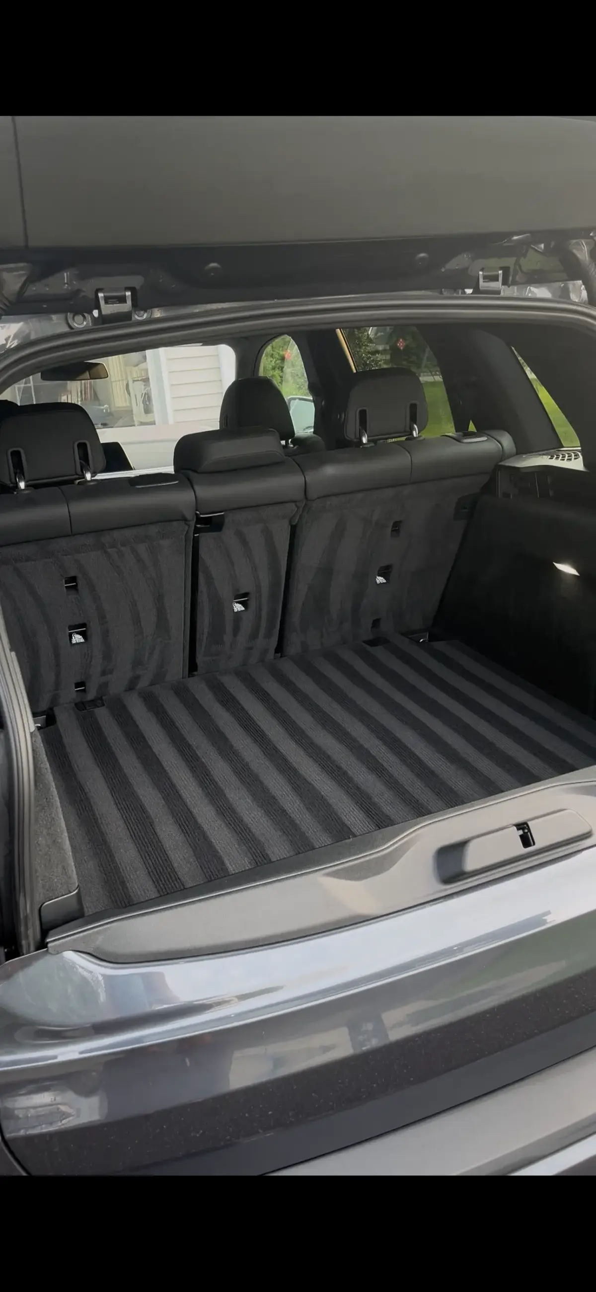 Trunk cleaned with fresh carpet lines after interior detail